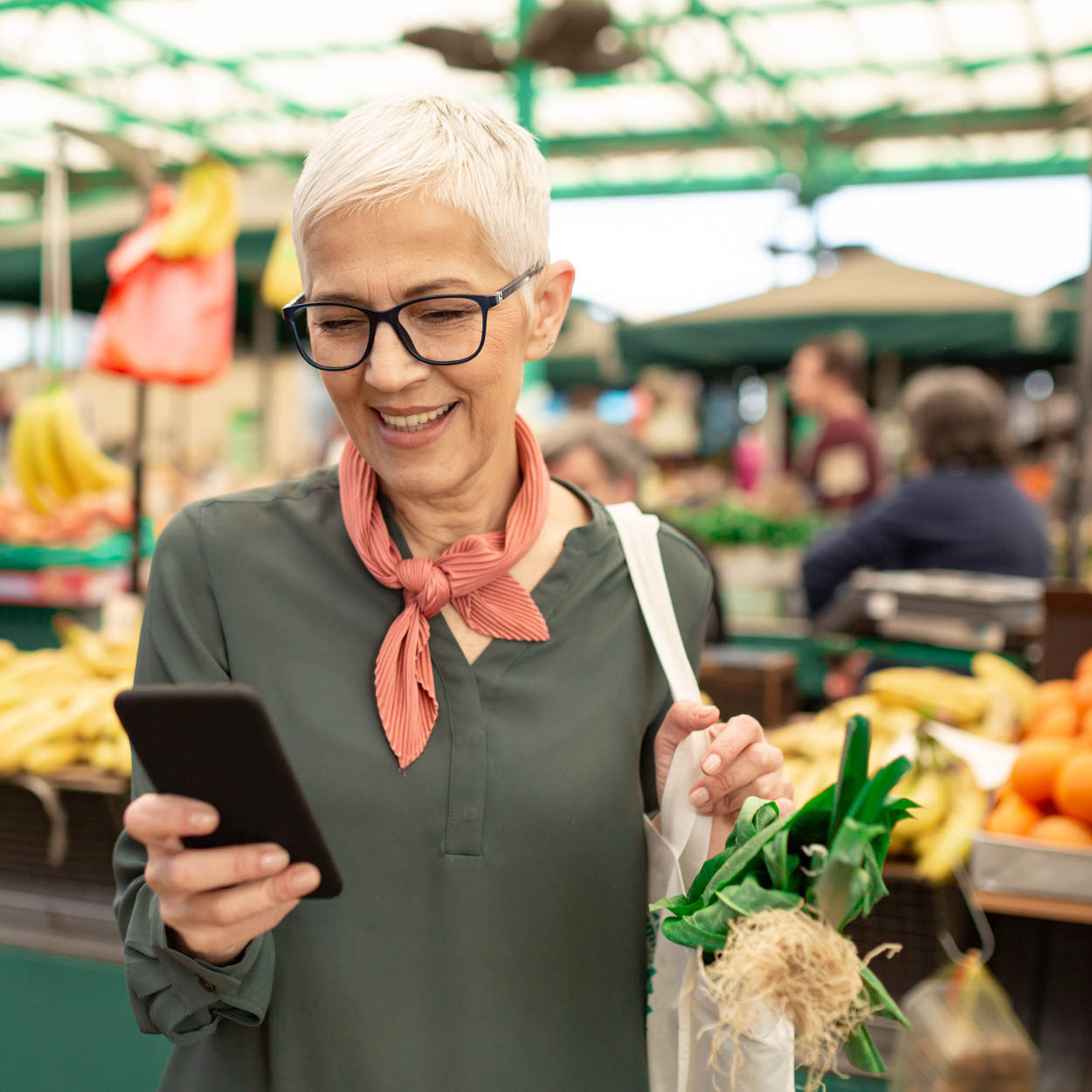 Senior citizen using automated campaign at farmer's market